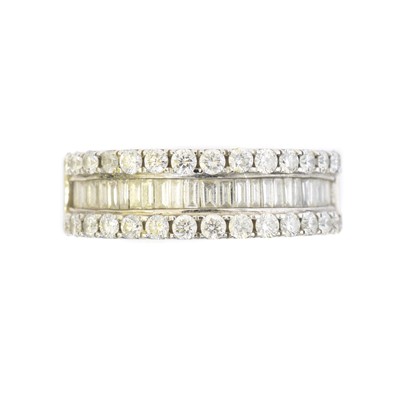 Lot 86 - An 18ct gold diamond band ring