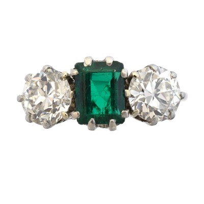 Lot 163 - An emerald and diamond three stone ring
