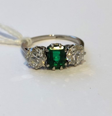 Lot 163 - An emerald and diamond three stone ring