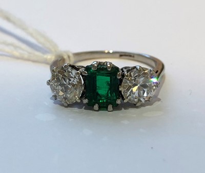 Lot 163 - An emerald and diamond three stone ring
