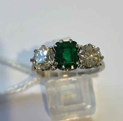 Lot 163 - An emerald and diamond three stone ring