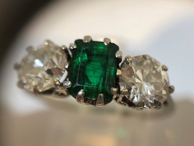 Lot 163 - An emerald and diamond three stone ring