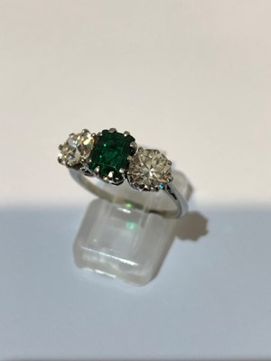 Lot 163 - An emerald and diamond three stone ring