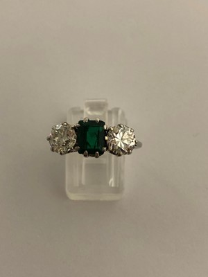 Lot 163 - An emerald and diamond three stone ring