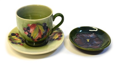 Lot 129 - Moorcroft Cup & Saucer and Pin Dish