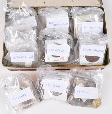 Lot 55 - Tin of assorted foreign coinage to include many silver coins from Netherlands etc.