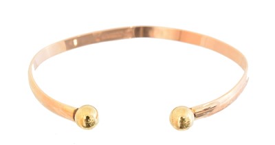 Lot 8 - A 9ct gold torque bangle
