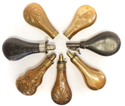 Lot 201 - Four powder flasks, a shot flask and two powder flask bodies