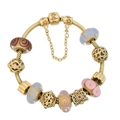Lot 12 - A 14ct gold Pandora charm bracelet
