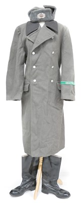 Lot 376 - East German Great coat, jack boots and hat