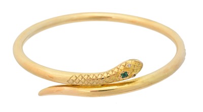 Lot 14 - An early 20th century gold emerald and diamond snake bangle