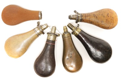 Lot 210 - Five powder flasks and a flask body
