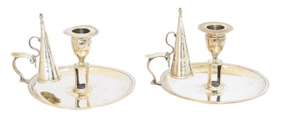 Lot 159 - A pair of William IV silver chambersticks
