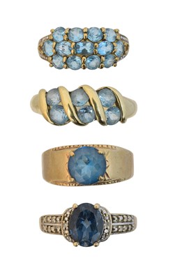 Lot 157 - Four 9ct gold blue topaz dress rings