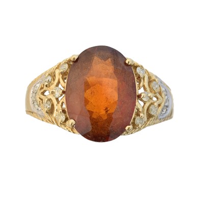 Lot 52 - A hessonite garnet and diamond dress ring
