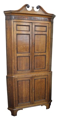 Lot 318 - George III oak floor standing corner cupboard