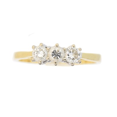 Lot 76 - An 18ct gold diamond three stone ring
