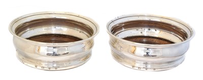 Lot 138 - Two Elizabeth II silver wine coasters