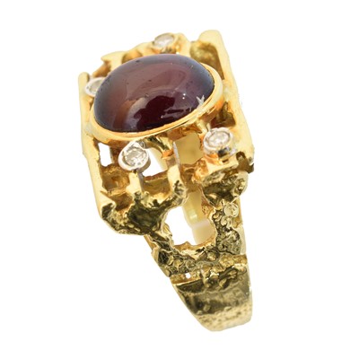 Lot 120 - A 1960s garnet and diamond dress ring by George Weil