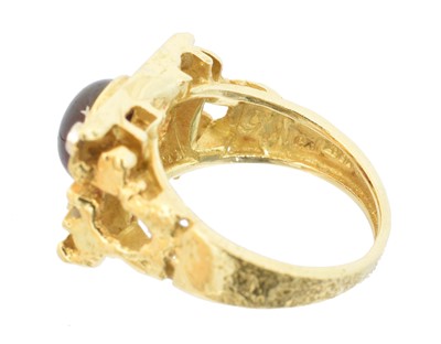 Lot 120 - A 1960s garnet and diamond dress ring by George Weil