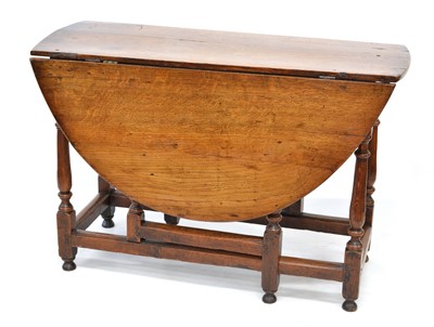 Lot 371 - 18th-century oak drop-leaf dining table