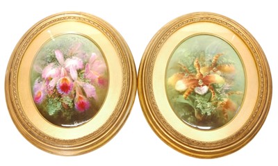 Lot 214 - Pair of hand painted floral wall plaques