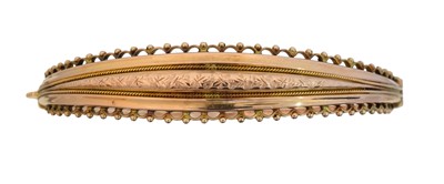 Lot 38 - An early 20th century 9ct gold hinged bangle