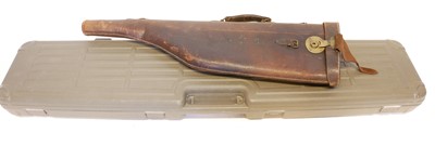 Lot 252 - Rifle / Shotgun hardcase and a leg of mutton leather shotgun case