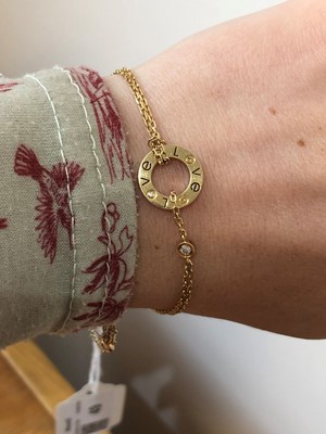 Lot 49 - An 18ct gold diamond 'Love' bracelet by Cartier
