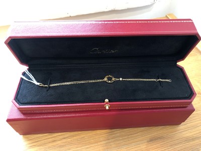 Lot 49 - An 18ct gold diamond 'Love' bracelet by Cartier