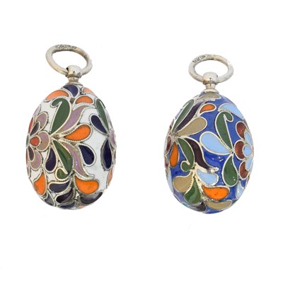 Lot 58 - Two silver enamel egg pendants