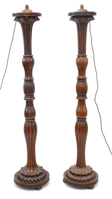 Lot 209 - A pair of torcheres