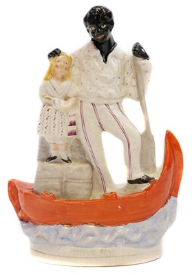 Lot 135 - Staffordshire Dudson pottery figure of Uncle Tom and Eva on a boat
