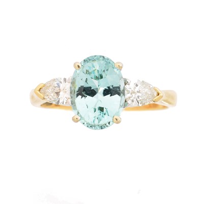 Lot 163 - A tourmaline and diamond three stone ring