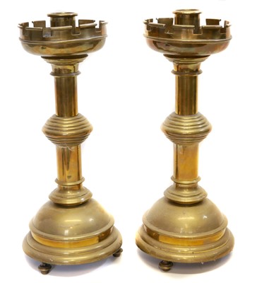 Lot 221 - Pair of Victorian gothic brass candlesticks
