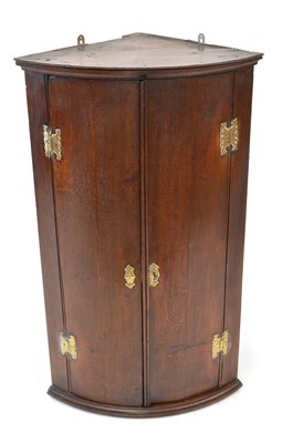 Lot 315 - George III corner cupboard