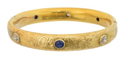Lot 42 - A sapphire and diamond hinged bangle