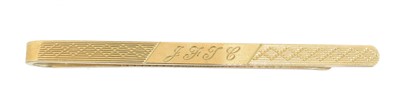 Lot 8 - A 9ct gold tie slide