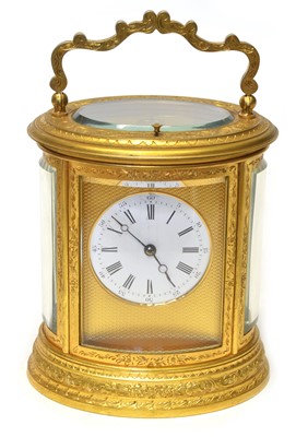 Lot 184 - Late 19th-century gilded brass carriage clock