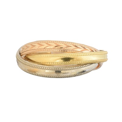 Lot 105 - An 18ct gold band ring