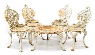 Lot 301 - Four cast iron chairs and table