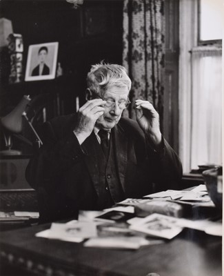 Lot 69 - L.S. Lowry R.A. (British 1887-1976) at his home in Mottram, photograph.