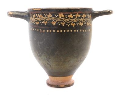 Lot 114 - A Gnathian ware painted skyphos, Greek South Italy, circa 4th century BC.