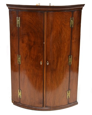 Lot 260 - George III corner cupboard