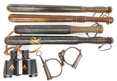 Lot 396 - Four truncheons, and hand cuffs