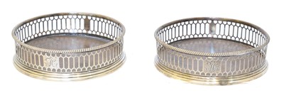 Lot 60 - A pair of George III silver wine coasters