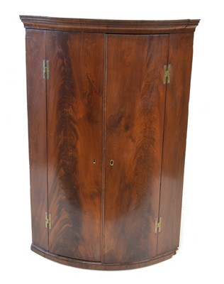 Lot 247 - George III corner cupboard
