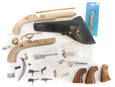 Lot 241 - Collection of reproduction muzzle loading pistol spares and a holster