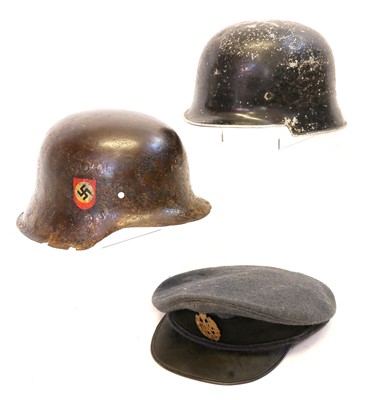 Lot 374 - Two German WWII helmets and an RAF cap