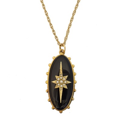 Lot 85 - A split pearl and onyx pendant